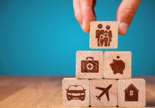 wooden blocks with different insurance types written on them