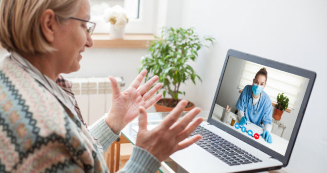 Person on a virtual video call with a doctor